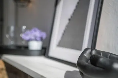 a hand is pressing a button on a microwave at Stylish Duplex House with a Special Terrace in Istanbul