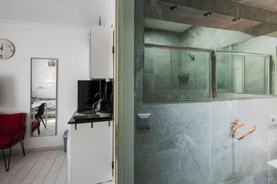 a bathroom with a walk in shower and a sink at Cute 1 Room w AC 300 meters to Istiklal Street in Istanbul
