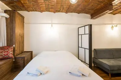 a bedroom with a bed and a couch at Beautiful 1 Br Apt. w/AC 400 meters Taksim Square in Istanbul
