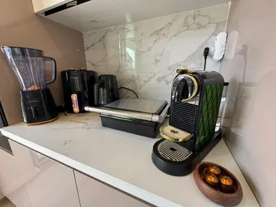 a kitchen counter with a toaster and a blender at Stylish 2BR and 3BR Izmit Apartments- Chic & Cozy in Çavuşçiftliği
