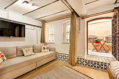 a living room with a couch and a window at Armel Homes Galata in Istanbul