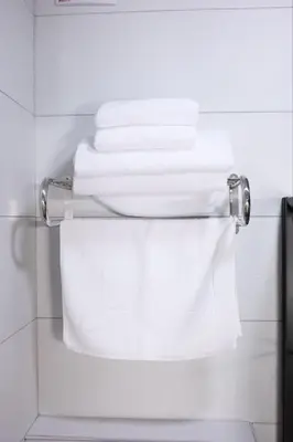 a stack of white towels in a bathroom at Evra Suites Hotel in Istanbul