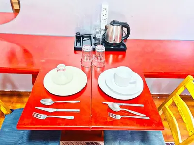 a red table with plates and cutlery on it at Taksim Ottoman Style Hotel in Istanbul