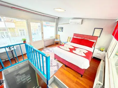 a bedroom with a bed and a balcony at Taksim Ottoman Style Hotel in Istanbul