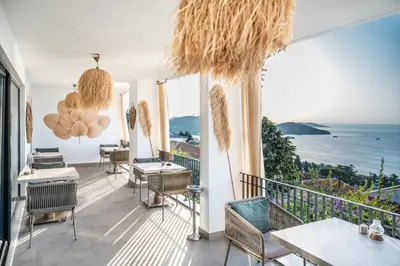 a restaurant with a view of the ocean at Hillora Hotel Buyukada in Adalar