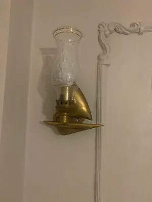 a lamp hanging on a wall next to a mirror at Balat Tarihin içinden Pink Home 1 in Istanbul