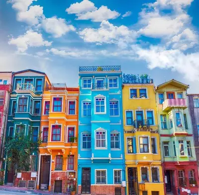 a row of colorful houses on a city street at Balat Tarih dokulu Pink Home 2 in Istanbul