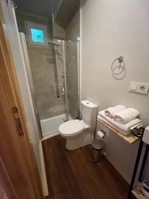 a bathroom with a shower and a toilet and a sink at Balat Tarih dokulu Pink Home 2 in Istanbul