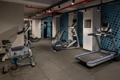 a gym with several exercise equipment in a room at Hampton By Hilton Istanbul Merter in Istanbul