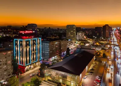 a city lit up at night with traffic at Hampton By Hilton Istanbul Merter in Istanbul
