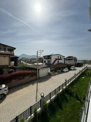 a street with cars parked in a parking lot at Luxurious 3BR Izmit Apartments- Mountain View in Çavuşçiftliği