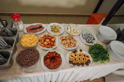 a table with many plates of food on it at Topkapi Golden Time Hotel in Istanbul