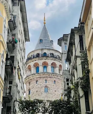 a building with a tower in the middle of buildings at Topkapi Golden Time Hotel in Istanbul