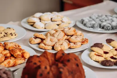 a table with plates of different pastries on them at Topkapi Golden Time Hotel in Istanbul