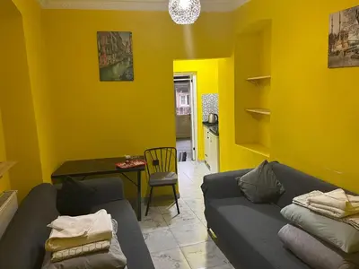 a living room with a couch and a table at Taksim academie house in Istanbul