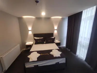 a bedroom with a bed with two pillows on it at Cevvo Hotel Pendik in Istanbul