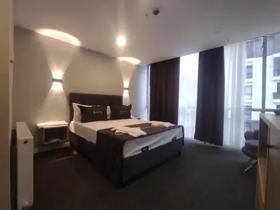 a hotel room with a bed and a window at Cevvo Hotel Pendik in Istanbul