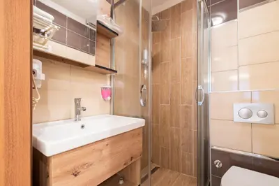a bathroom with a sink and a shower at Fulya Süit Hotel in Istanbul