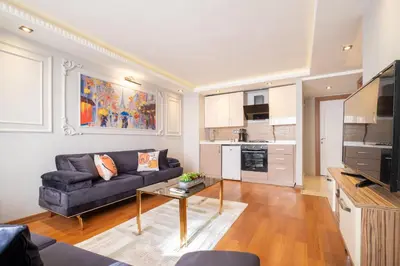 a living room with a couch and a table at Fulya Süit Hotel in Istanbul