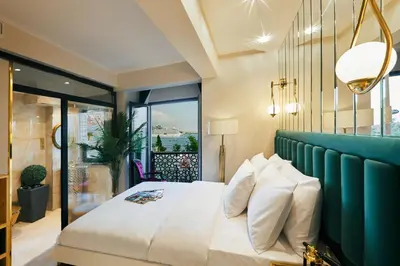a bedroom with a large bed and a large window at Mitspark in Istanbul