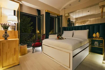 a bedroom with a large bed and a window at Mitspark in Istanbul
