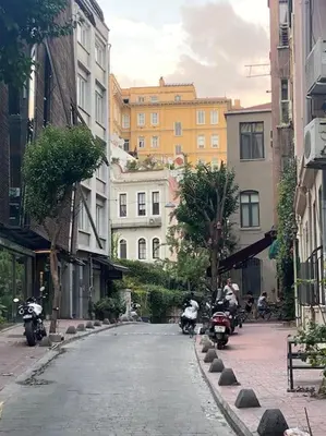 a group of people riding motorcycles down a street at Charming historical apartment in Galata in Istanbul
