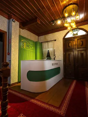 a room with a table in the middle of a room at Araz White House in Burgaz