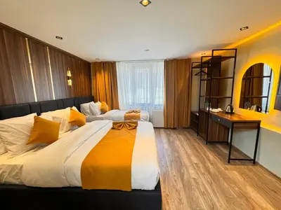 a hotel room with a large bed and a desk at Galata Calm Tale Hotel in Istanbul
