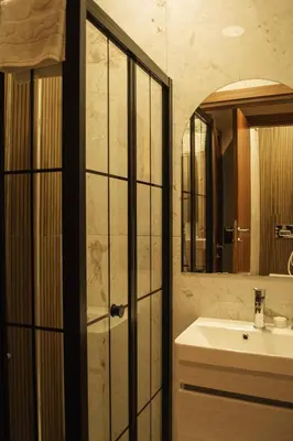 a bathroom with a sink and a mirror at Galata Calm Tale Hotel in Istanbul