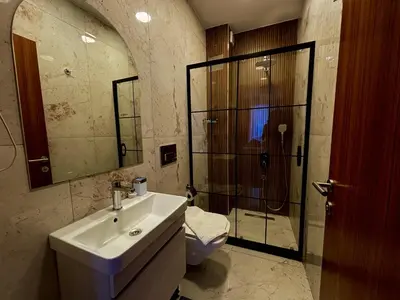 a bathroom with a sink and a shower and a toilet at Galata Calm Tale Hotel in Istanbul