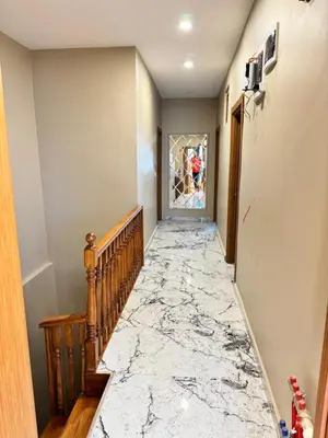 a hallway with marble flooring and a marble staircase at Riverside Hotel in Istanbul