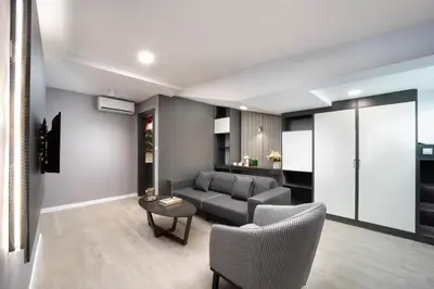 a living room with a couch and chairs and a table at Siesta Hotel Bakırköy in Istanbul