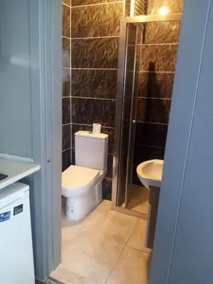 a bathroom with a toilet and a sink at Zeplin Otel in Istanbul