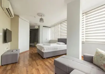 a bedroom with a bed and a couch at Zeplin Otel in Istanbul