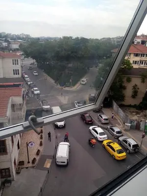a view from a window of a street with cars at Zeplin Otel in Istanbul
