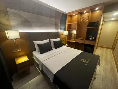 a bedroom with a large bed in a room at The Best Hotel İstanbul in Istanbul