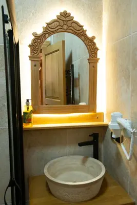 a bathroom with a large bowl sink under a mirror at İstanbul Eagle's Nest Boutique Hotel in Istanbul