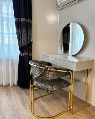 a dressing table with a mirror and a chair at New Hotel Harbiye Studio in Istanbul