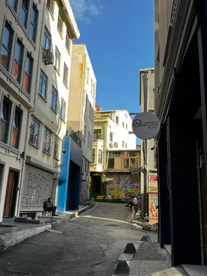 an empty alley with buildings and a street sign at Querencia Hotel in Istanbul