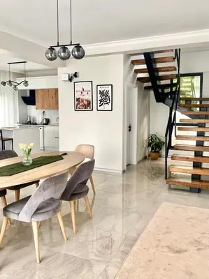 a kitchen and dining room with a table and chairs at High Garden Villas in Sapanca