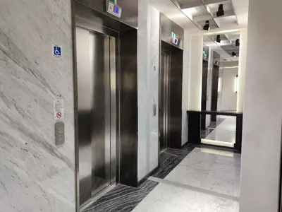 a hallway with elevators in a building at The Palm Bosphorus Hotel in Istanbul