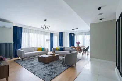 a living room with two couches and a table at The Superior Living Kağıthane in Istanbul