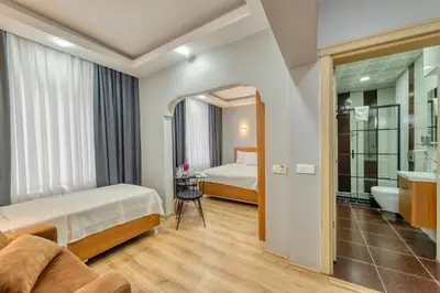 a hotel room with a bed and a bathroom at Pio Apart Hotel in Istanbul