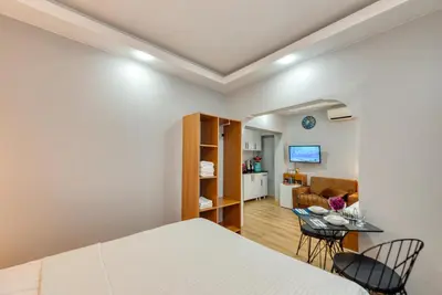 a bedroom with a bed and a living room at Pio Apart Hotel in Istanbul
