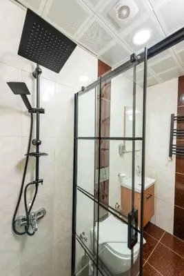 a glass shower in a bathroom with a toilet at Pio Apart Hotel in Istanbul