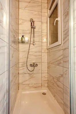 a bathroom with a shower with a tub at Armel Homes Beyoğlu in Istanbul
