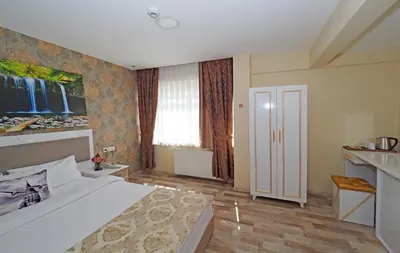 a bedroom with a large bed in a room at Nagehan Hotel Old City in Istanbul