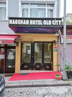 a hotel with a red rug in front of a door at Nagehan Hotel Old City in Istanbul