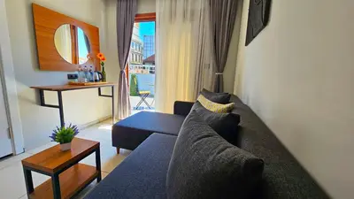 a living room with a couch and a table at Vera Taksim Hotel in Istanbul