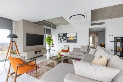 a living room with a couch and a tv at Gorgeous 3BD2Bath Bright Airy Penthouse! #355 in Istanbul